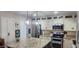 Well-lit kitchen with stainless steel appliances, granite countertops, and a stylish kitchen island at 4855 W Turquoise Ave, Glendale, AZ 85302