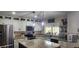 Well-lit kitchen with stainless steel appliances, granite countertops, and a stylish kitchen island at 4855 W Turquoise Ave, Glendale, AZ 85302
