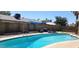 Backyard pool with clear water, lounge chairs, and privacy features for relaxation and enjoyment at 4855 W Turquoise Ave, Glendale, AZ 85302