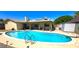 Backyard pool with ample deck space and a covered patio, ideal for relaxation and outdoor gatherings at 4855 W Turquoise Ave, Glendale, AZ 85302
