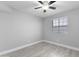 Bright bedroom featuring a window, ceiling fan, and neutral color palette at 533 W Guadalupe Rd # 1068, Mesa, AZ 85210