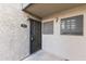 View of building 1068 front door, security door and sconce lighting at 533 W Guadalupe Rd # 1068, Mesa, AZ 85210
