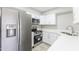 Bright kitchen featuring stainless steel appliances and white cabinets at 533 W Guadalupe Rd # 1068, Mesa, AZ 85210
