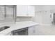 Modern kitchen with stainless steel dishwasher and white cabinets at 533 W Guadalupe Rd # 1068, Mesa, AZ 85210