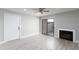 Bright living room with entry door, sliding glass door, and fireplace at 533 W Guadalupe Rd # 1068, Mesa, AZ 85210