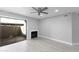 Bright living room with sliding glass door, fireplace, and modern ceiling fan at 533 W Guadalupe Rd # 1068, Mesa, AZ 85210