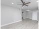 Spacious living room featuring a modern ceiling fan and neutral color palette at 533 W Guadalupe Rd # 1068, Mesa, AZ 85210
