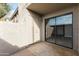 View of outdoor patio with exterior door and sliding glass door access to interior at 533 W Guadalupe Rd # 1068, Mesa, AZ 85210