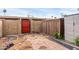Fenced in backyard with storage shed, brick pavers, and red door at 5339 N Black Canyon Hwy, Phoenix, AZ 85015