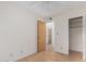 Neutral bedroom with wood-look floors, closet, and doorway at 5339 N Black Canyon Hwy, Phoenix, AZ 85015
