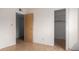 Spacious bedroom with wood-look flooring and closet access at 5339 N Black Canyon Hwy, Phoenix, AZ 85015