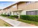 Beautiful townhome exterior showcasing well-manicured landscaping and a neat walkway at 5339 N Black Canyon Hwy, Phoenix, AZ 85015