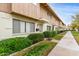 Pleasant view of townhome exteriors, featuring meticulous landscaping and sidewalks at 5339 N Black Canyon Hwy, Phoenix, AZ 85015