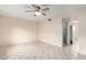 Bright living room with neutral walls, tile floor, and a ceiling fan for comfortable living at 5339 N Black Canyon Hwy, Phoenix, AZ 85015