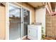 Outdoor patio with sliding door to the house and laundry appliances ready for use at 5339 N Black Canyon Hwy, Phoenix, AZ 85015