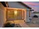 Charming covered front entrance of home with security door and desert landscaping at 5830 W Cinnabar Ave, Glendale, AZ 85302