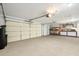 Spacious two-car garage features ample storage space and a convenient workbench area for projects at 5830 W Cinnabar Ave, Glendale, AZ 85302