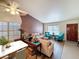 Open-concept living room features neutral furniture, hardwood floors, and ample natural light, creating a warm and inviting atmosphere at 5830 W Cinnabar Ave, Glendale, AZ 85302