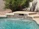Water cascades down the tiled fountain feature into a refreshing pool at 5830 W Cinnabar Ave, Glendale, AZ 85302