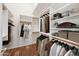 Organized walk-in closet features custom shelving and ample storage space for clothing and accessories at 5830 W Cinnabar Ave, Glendale, AZ 85302