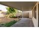 Backyard featuring covered patio and wooden picnic table, perfect for outdoor dining and entertaining at 6320 N 30Th Dr, Phoenix, AZ 85017