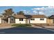 Charming single-story home featuring a landscaped yard and a welcoming front entrance at 6320 N 30Th Dr, Phoenix, AZ 85017