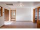 Open living space with tile flooring, recessed lighting, and multiple access points at 6320 N 30Th Dr, Phoenix, AZ 85017