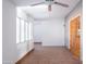 Bright living room featuring a ceiling fan, large windows, and neutral color scheme at 6320 N 30Th Dr, Phoenix, AZ 85017