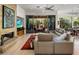 Open-concept living room showcasing a fireplace with a seamless transition to the outdoor space at 6522 N 27Th St, Phoenix, AZ 85016
