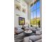 Bright living area with tall windows and circle lighting fixtures, perfect for entertaining at 6522 N 27Th St, Phoenix, AZ 85016