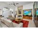 Inviting living room featuring a stone fireplace and entertainment center at 6522 N 27Th St, Phoenix, AZ 85016