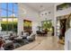 Open concept living room with soaring ceilings and large windows offering abundant natural light at 6522 N 27Th St, Phoenix, AZ 85016