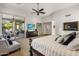Spacious main bedroom offering a private outdoor lounge area, tv, and plush decor at 6522 N 27Th St, Phoenix, AZ 85016