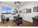 Office area featuring a wooden writing desk, neutral walls with framed art, and lots of natural light at 6522 N 27Th St, Phoenix, AZ 85016