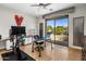 Bright office space with a large window offering an outdoor view, a desk, and workout equipment at 6522 N 27Th St, Phoenix, AZ 85016