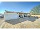 Backyard with covered patio and a storage shed at 701 N 95Th Cir, Mesa, AZ 85207