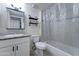 This bathroom boasts granite countertops, updated lighting, and tiled shower and backsplash at 701 N 95Th Cir, Mesa, AZ 85207