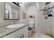 This bathroom is complete with granite countertops, tiled shower and backsplash, and modern hardware at 701 N 95Th Cir, Mesa, AZ 85207