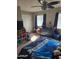 Bedroom with a large window and dresser and a large bed at 701 N 95Th Cir, Mesa, AZ 85207