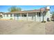 Home exterior featuring a basketball hoop on the driveway, perfect for outdoor activities at 701 N 95Th Cir, Mesa, AZ 85207
