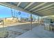 Covered patio showing backyard, trampoline and detached storage structure at 701 N 95Th Cir, Mesa, AZ 85207