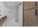 Modern bathroom showcasing sleek walk-in shower, vanity, and wood cabinetry with updated fixtures at 7157 E Rancho Vista Dr # 3001, Scottsdale, AZ 85251