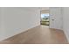 Bright bedroom features light wood flooring and large window overlooking the parking and retail spaces at 7157 E Rancho Vista Dr # 3001, Scottsdale, AZ 85251