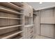 Custom closet with adjustable shelving and drawers provides ample storage, enhancing organization at 7157 E Rancho Vista Dr # 3001, Scottsdale, AZ 85251