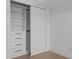 White closet system features shelving, drawers, and hanging rods for optimal storage, offering organization and convenience at 7157 E Rancho Vista Dr # 3001, Scottsdale, AZ 85251