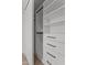 Closet system features shelving, drawers, and hanging rods for optimal storage, offering organization and convenience at 7157 E Rancho Vista Dr # 3001, Scottsdale, AZ 85251