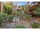 Courtyard water feature surrounded by trees and modern architecture at 7157 E Rancho Vista Dr # 3001, Scottsdale, AZ 85251