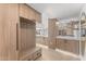 Hallway with custom wood storage and bench, stone countertops, recessed lighting, and modern design at 7157 E Rancho Vista Dr # 3001, Scottsdale, AZ 85251