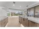 Open kitchen featuring marble countertops, custom wood cabinetry, stainless steel appliances, and recessed lighting at 7157 E Rancho Vista Dr # 3001, Scottsdale, AZ 85251