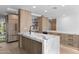 Gourmet kitchen features marble countertops, stainless steel appliances, custom wood cabinetry, and recessed lighting at 7157 E Rancho Vista Dr # 3001, Scottsdale, AZ 85251
